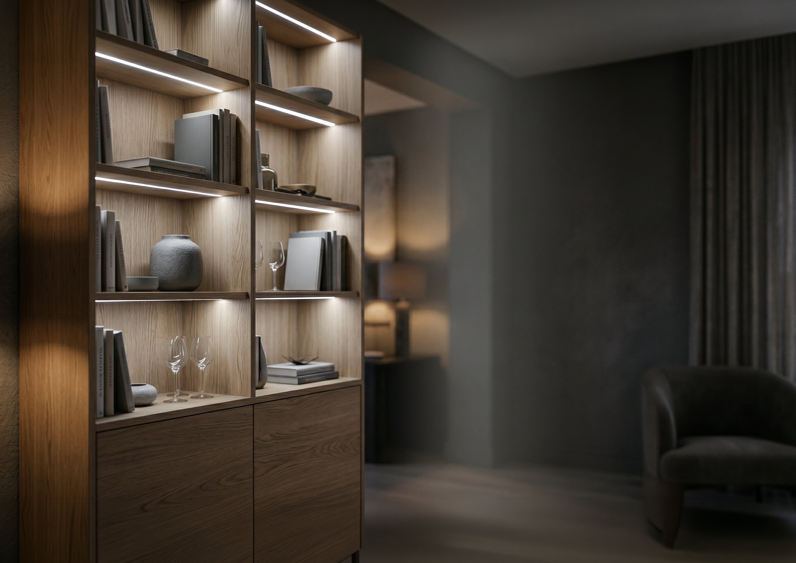 Close-up of illuminated bespoke shelving with concealed cabinet lighting