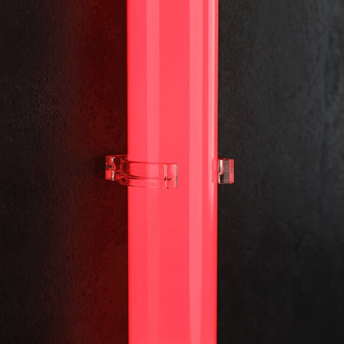 Transparent fixing clips securing a NeoLinear LED tube to a surface